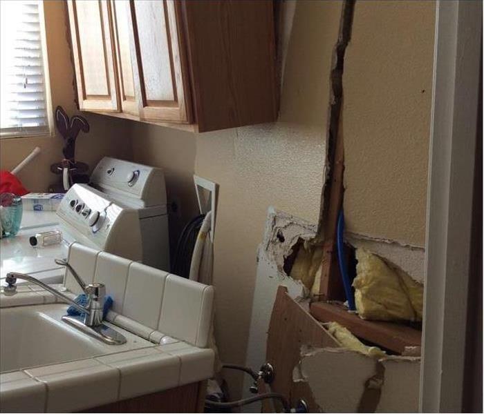 Laundry room wall crashed into and washer/dryer moved